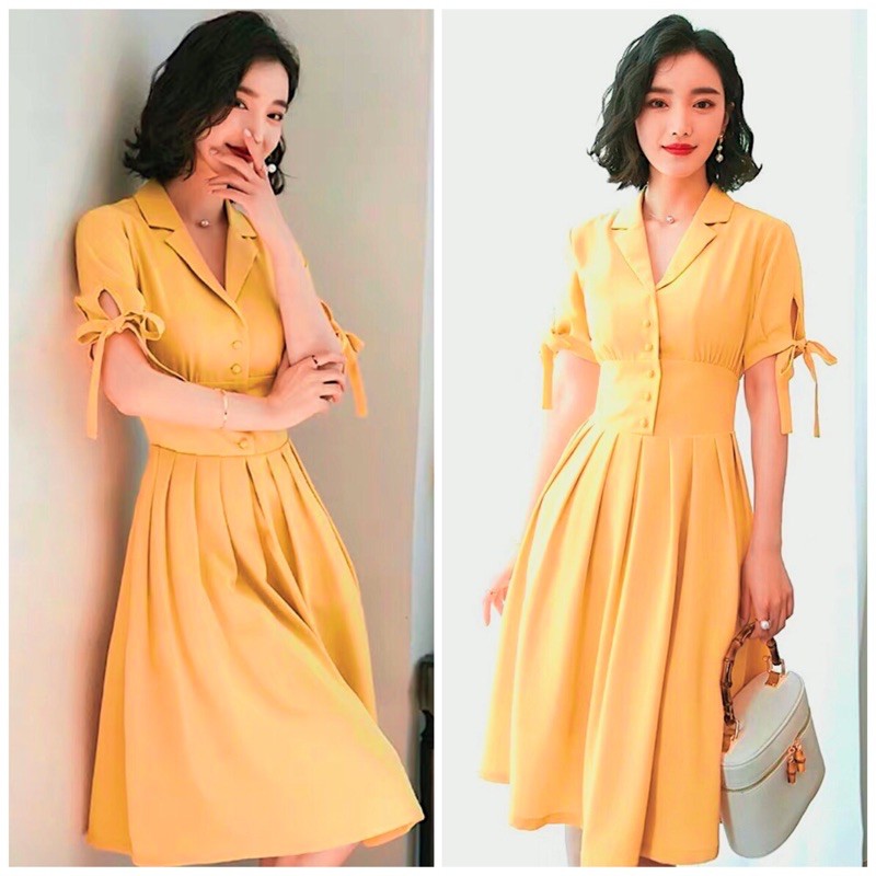 Đầm sm vàng nghệ nút bọc