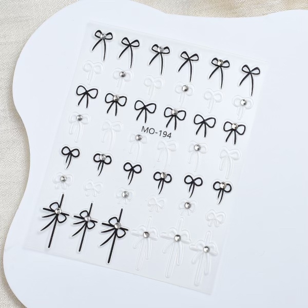 Sticker nơ dây đính đá đen - đỏ