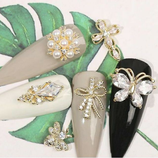 Charm Nơ Quốc Dân Cao Cấp Kim Loại