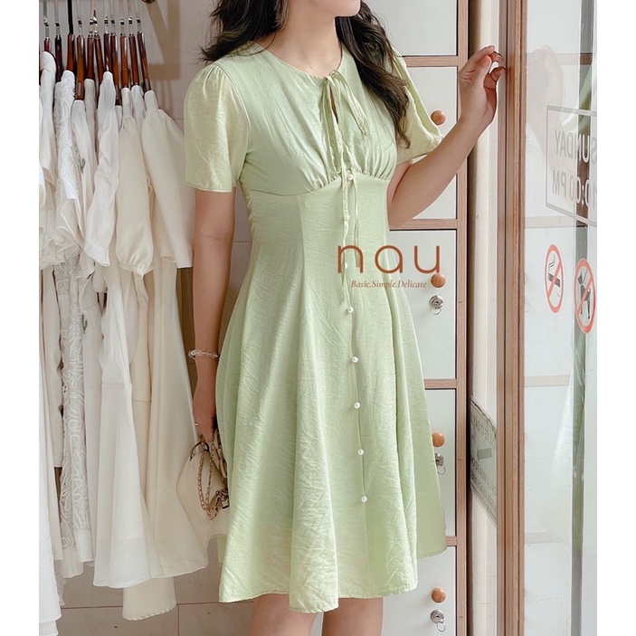 Đầm phối nút ngọc dáng xoè nhẹ cột nơ cổ