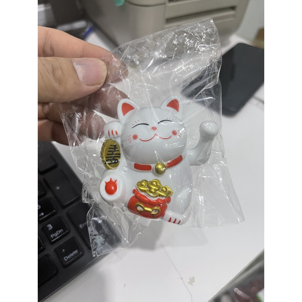 Ông thần tài trang trí bánh ngọc thịnh
