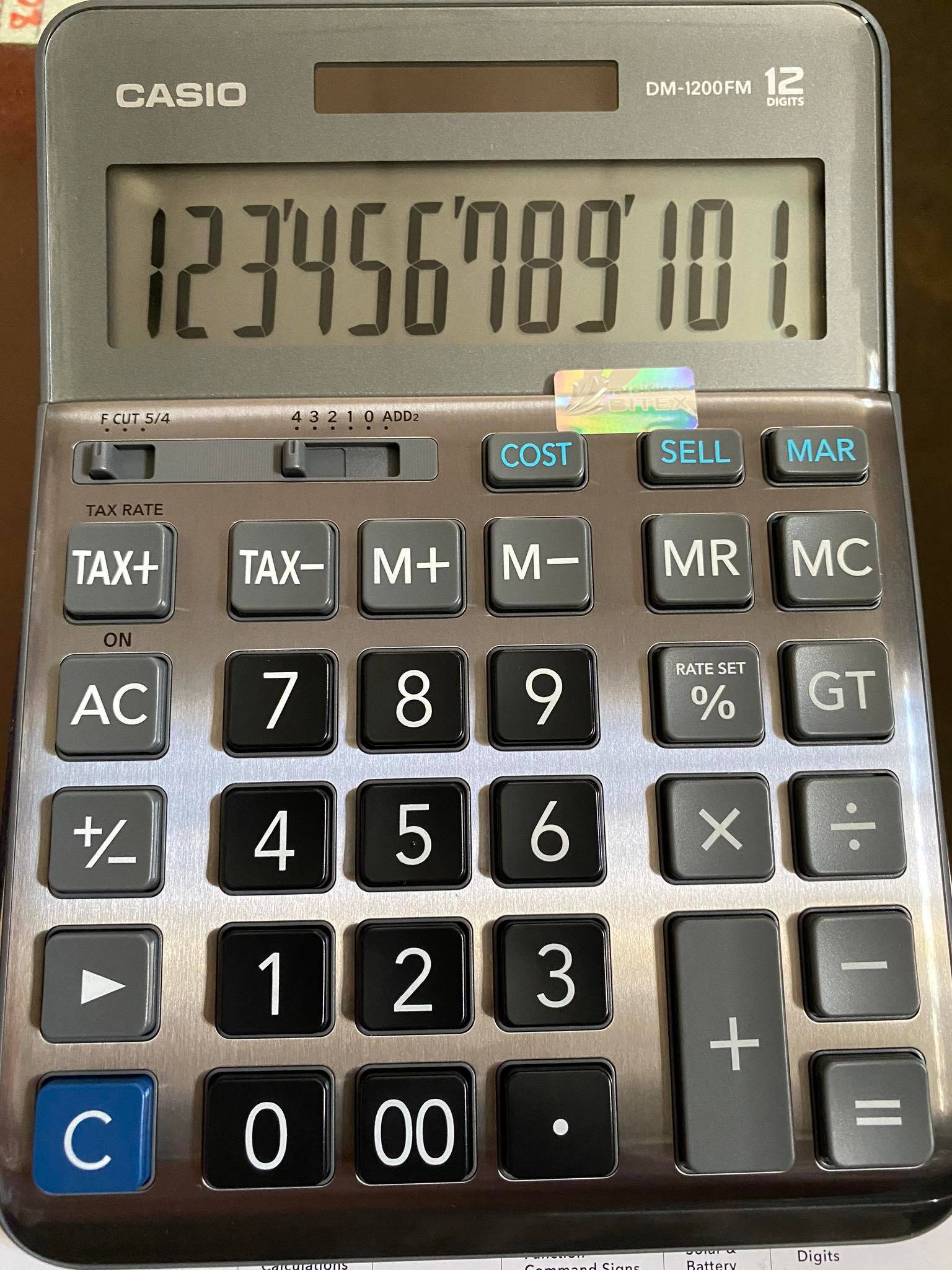 Máy tính casio dm 1200fm