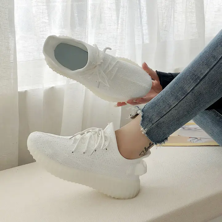 solid white running shoes