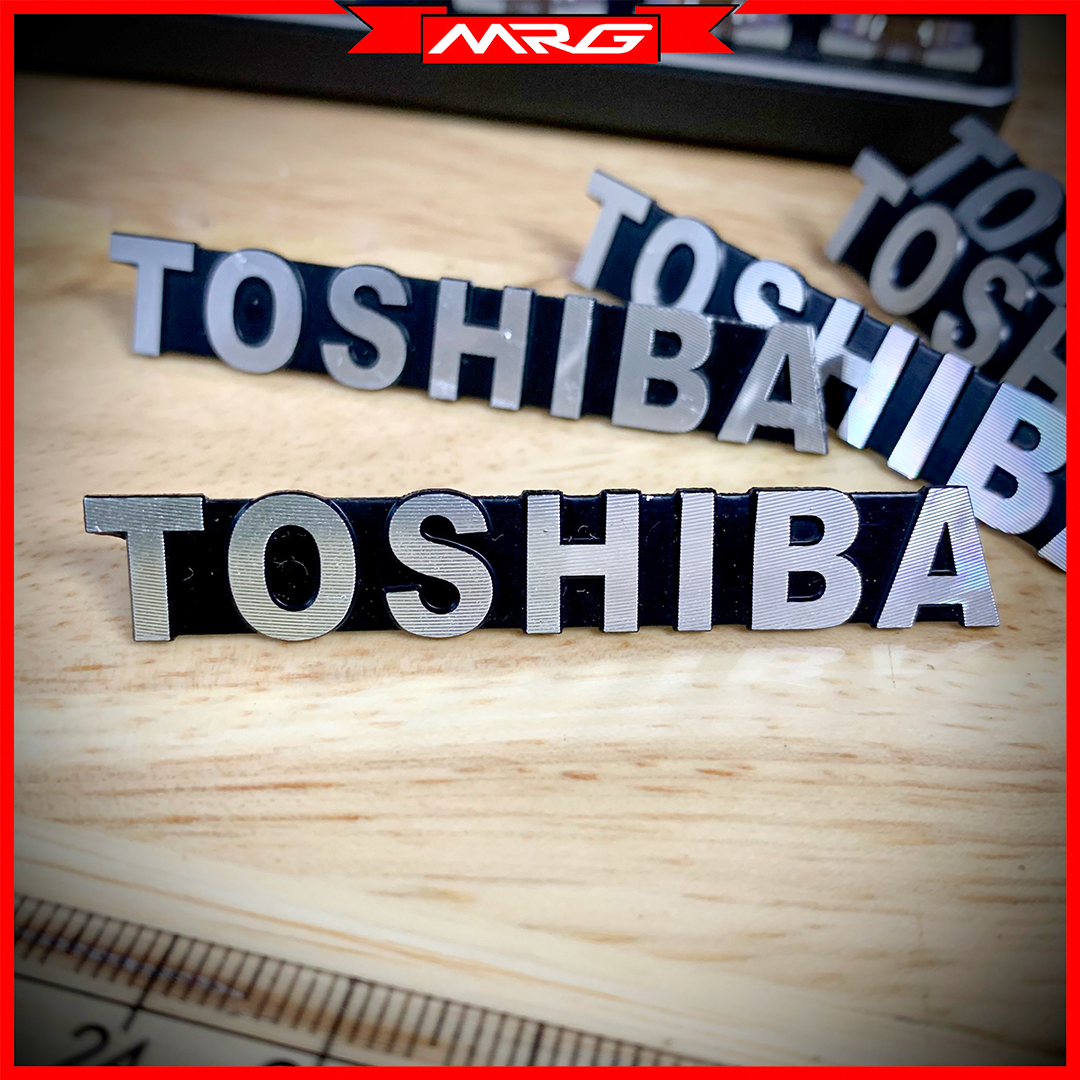 Tem/logo Toshiba nhôm, giá 1 chiếc.
