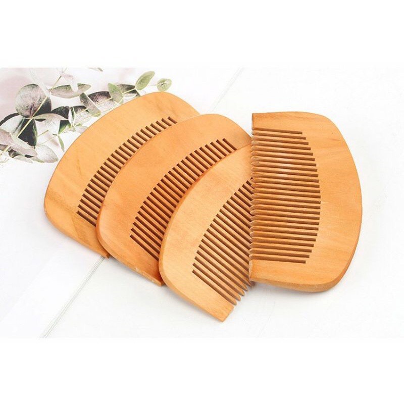 Lược chải tóc bằng gỗ massage đầu