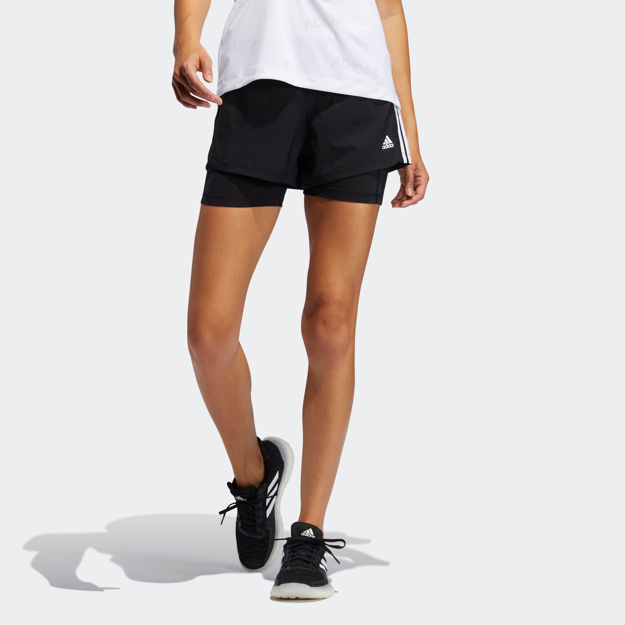 adidas TRAINING กางเกงผ้าทอขาสั้นดีไซน์ทูอินวัน Pacer 3-Stripes ผู้หญิง ...