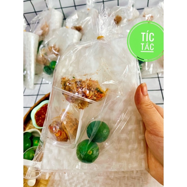 Rice Paper Dipped in Salt, Fried Shrimp, Onions, Sate, and Spicy Chili