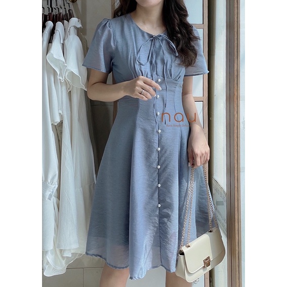 Đầm phối nút ngọc dáng xoè nhẹ cột nơ cổ