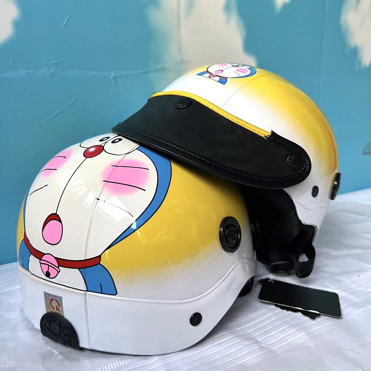 - NÓN BẢO HIỂM 2 LAI TEM DOREAMON