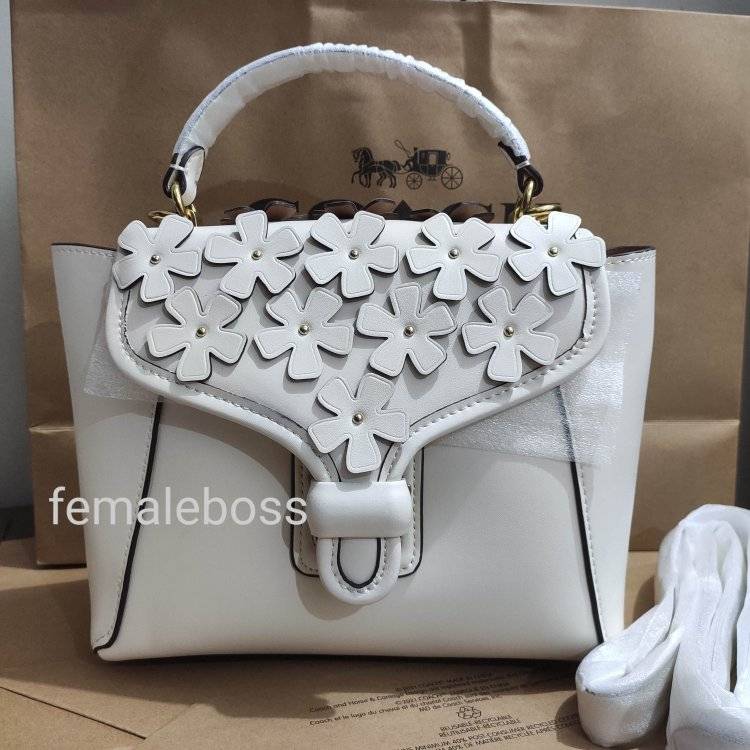 coach courier carryall 23 with floral applique