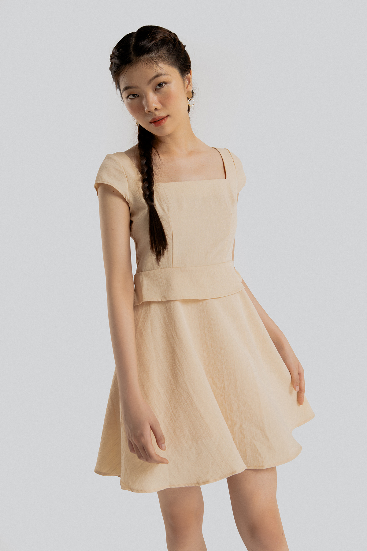 Đầm Maybi xòe linen thun be phối tà kiểu