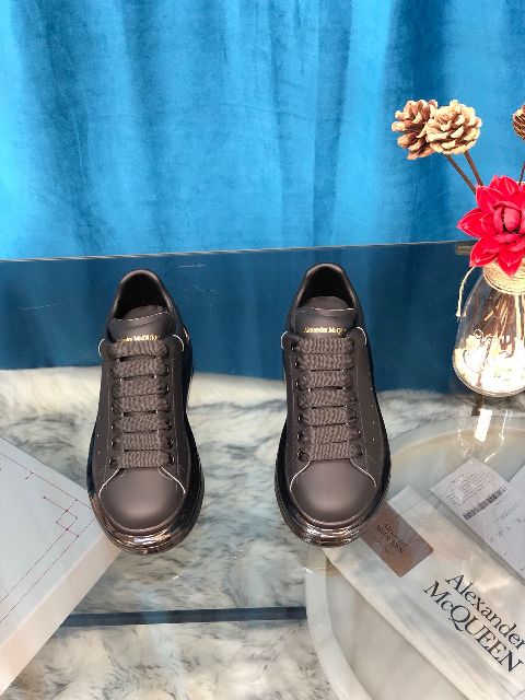 ALEXANDER MCQUEEN
Raised-sole low-top leather trainers
