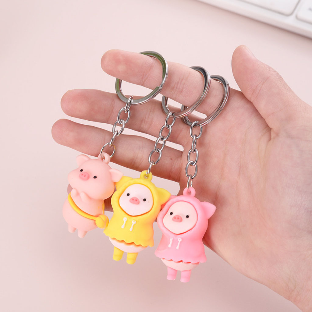 Móc khóa heo con mặc áo mưa cute