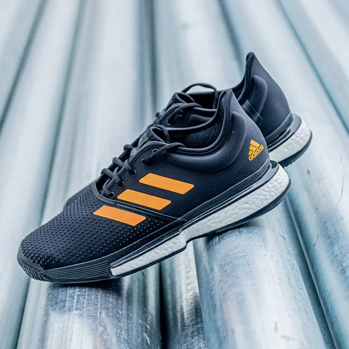 black and gold adidas tennis shoes