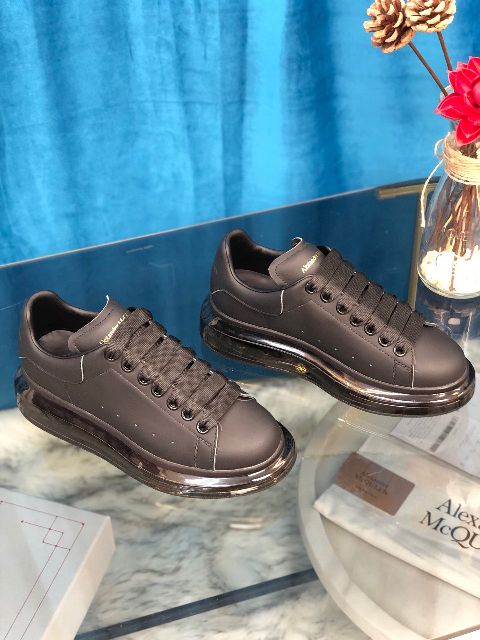 ALEXANDER MCQUEEN
Raised-sole low-top leather trainers