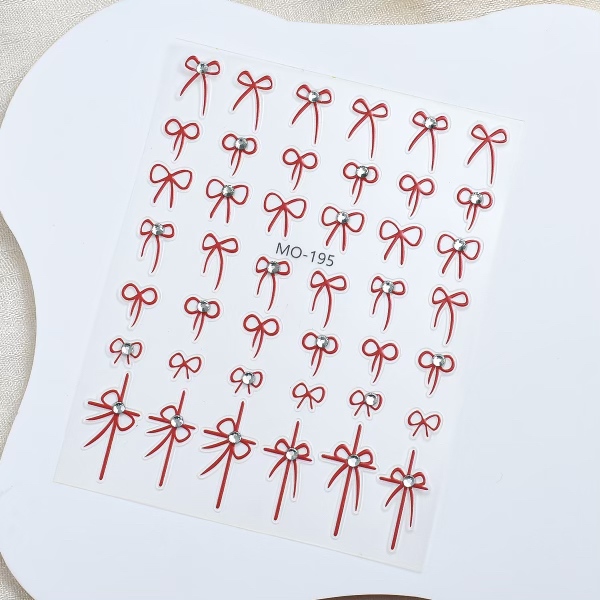 Sticker nơ dây đính đá đen - đỏ