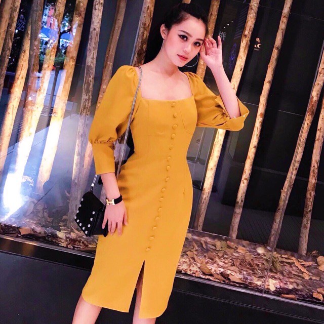 Đầm vàng cam nút bọc