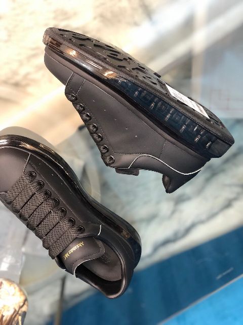 ALEXANDER MCQUEEN
Raised-sole low-top leather trainers