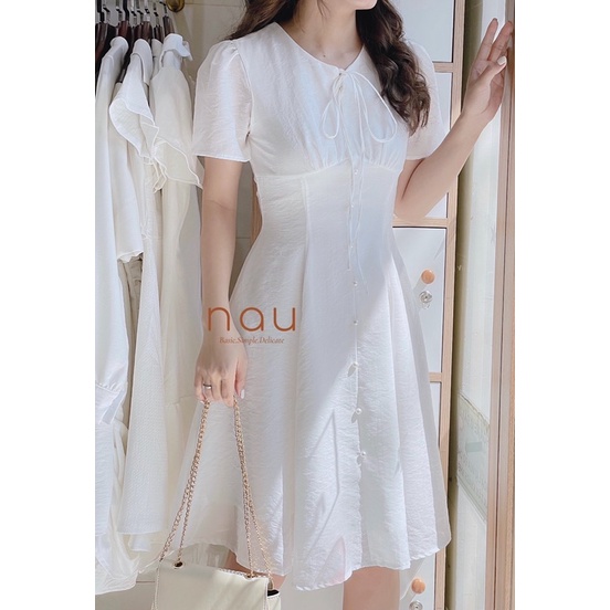 Đầm phối nút ngọc dáng xoè nhẹ cột nơ cổ