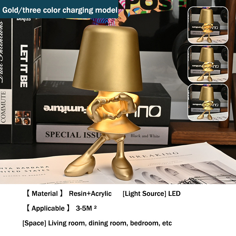 The little golden man touches the charging table lamp, the study bedroom, the bedside night light, the Italian ins decorative ornament, the resin lamp