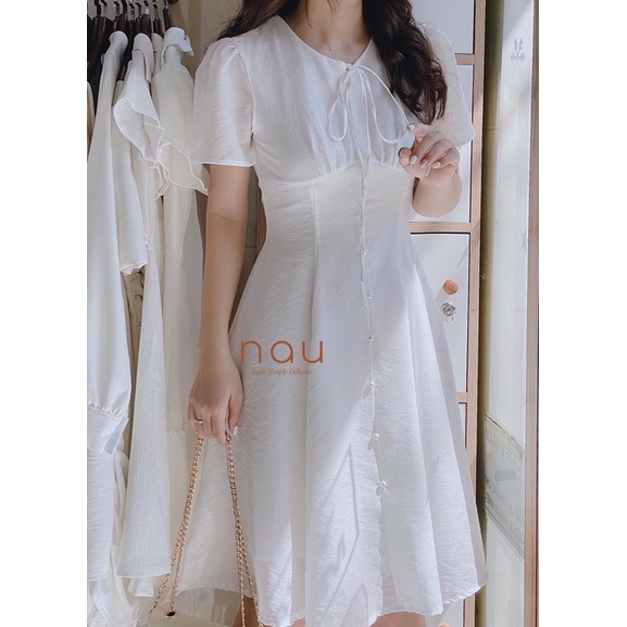 Đầm phối nút ngọc dáng xoè nhẹ cột nơ cổ