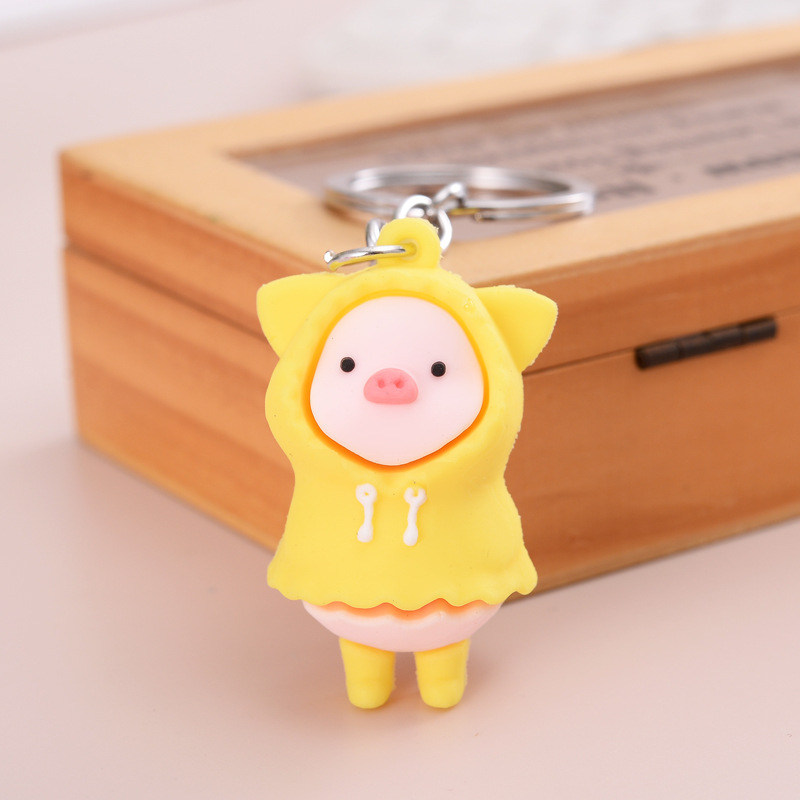 Móc khóa heo con mặc áo mưa cute